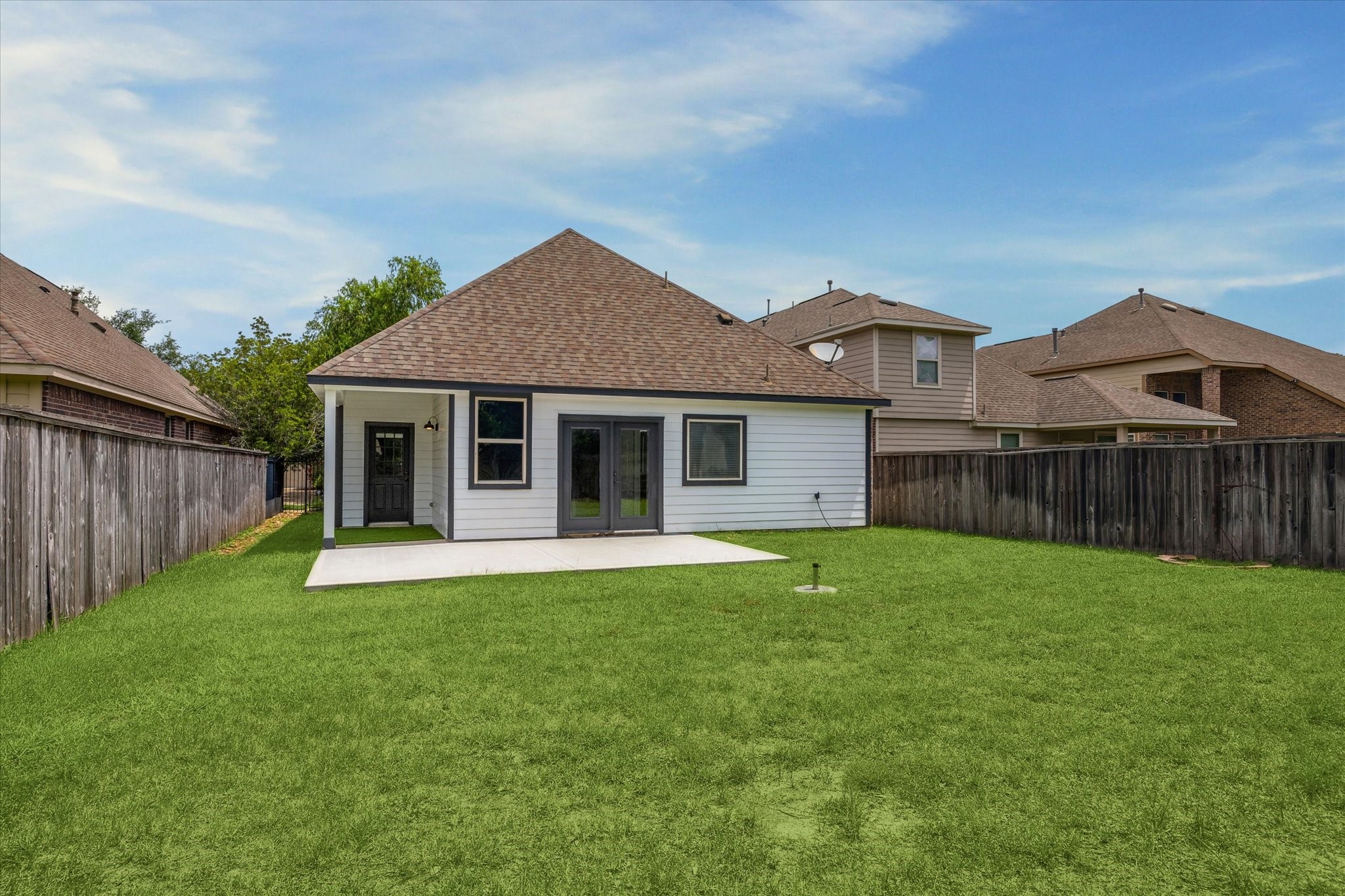 31 Butternut Grove Place Tomball, TX 77375 - Photo 21 of 25 a front view of a house with yard and green space