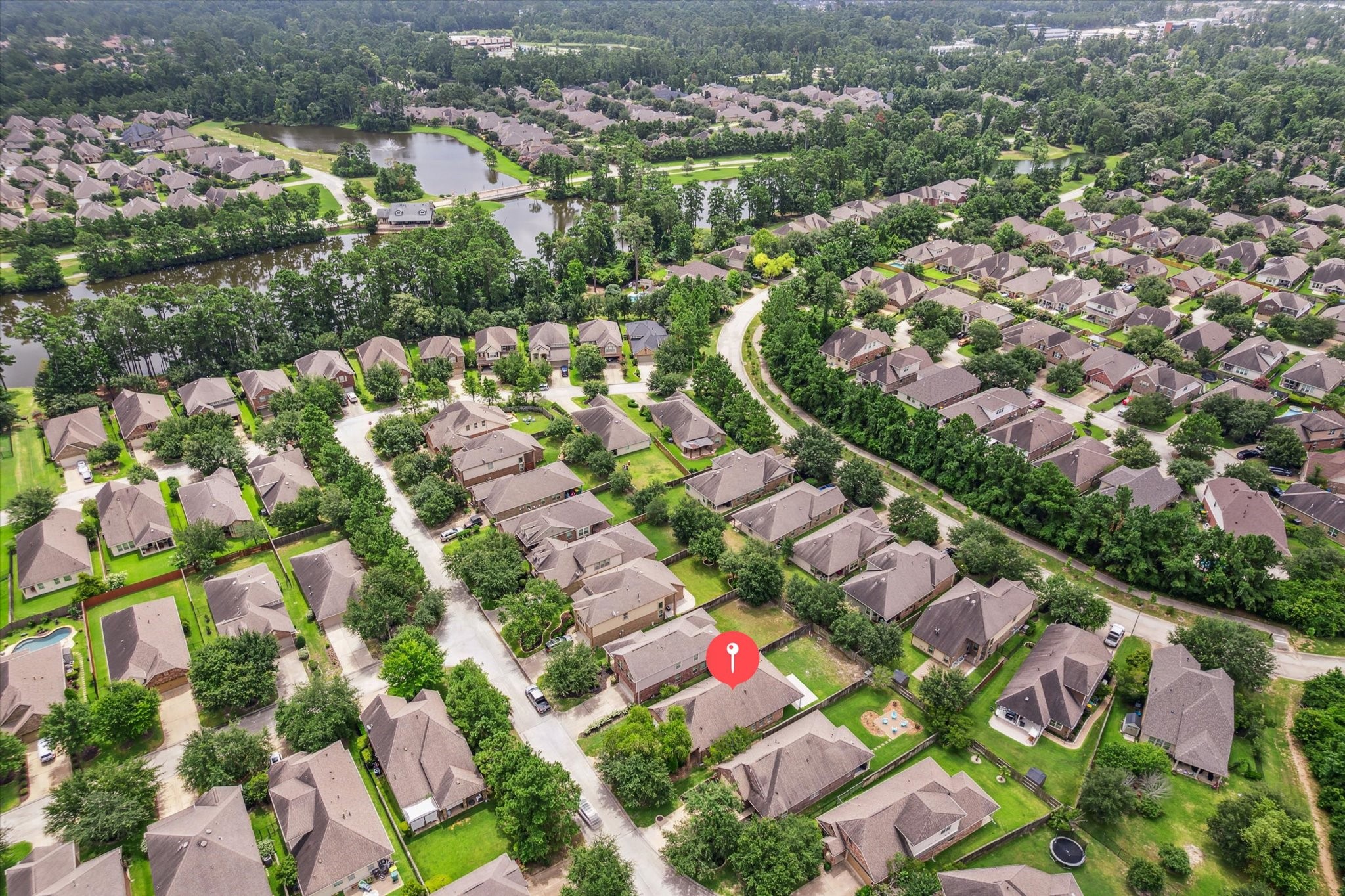 31 Butternut Grove Place Tomball, TX 77375 - Photo 23 of 25 an aerial view of residential houses with outdoor space and trees
