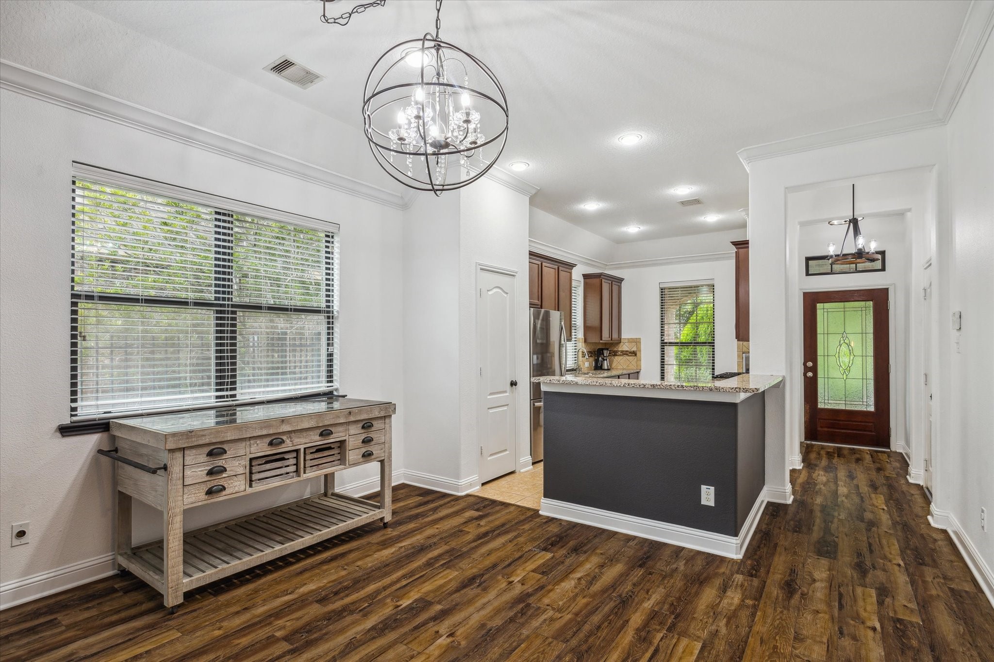 31 Butternut Grove Place Tomball, TX 77375 - Photo 3 of 25 a view of livingroom with kitchen island furniture and wooden floor