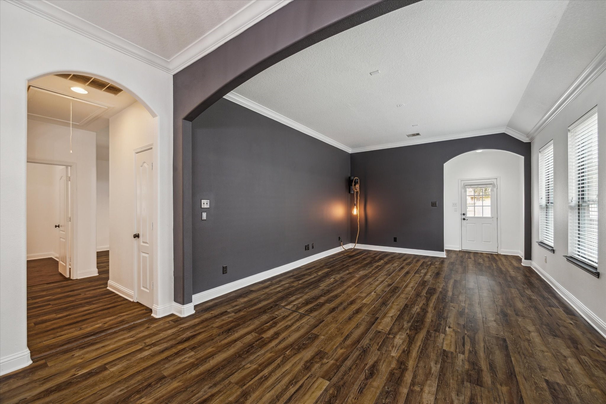 31 Butternut Grove Place Tomball, TX 77375 - Photo 8 of 25 a view of a livingroom with wooden floor and staircase