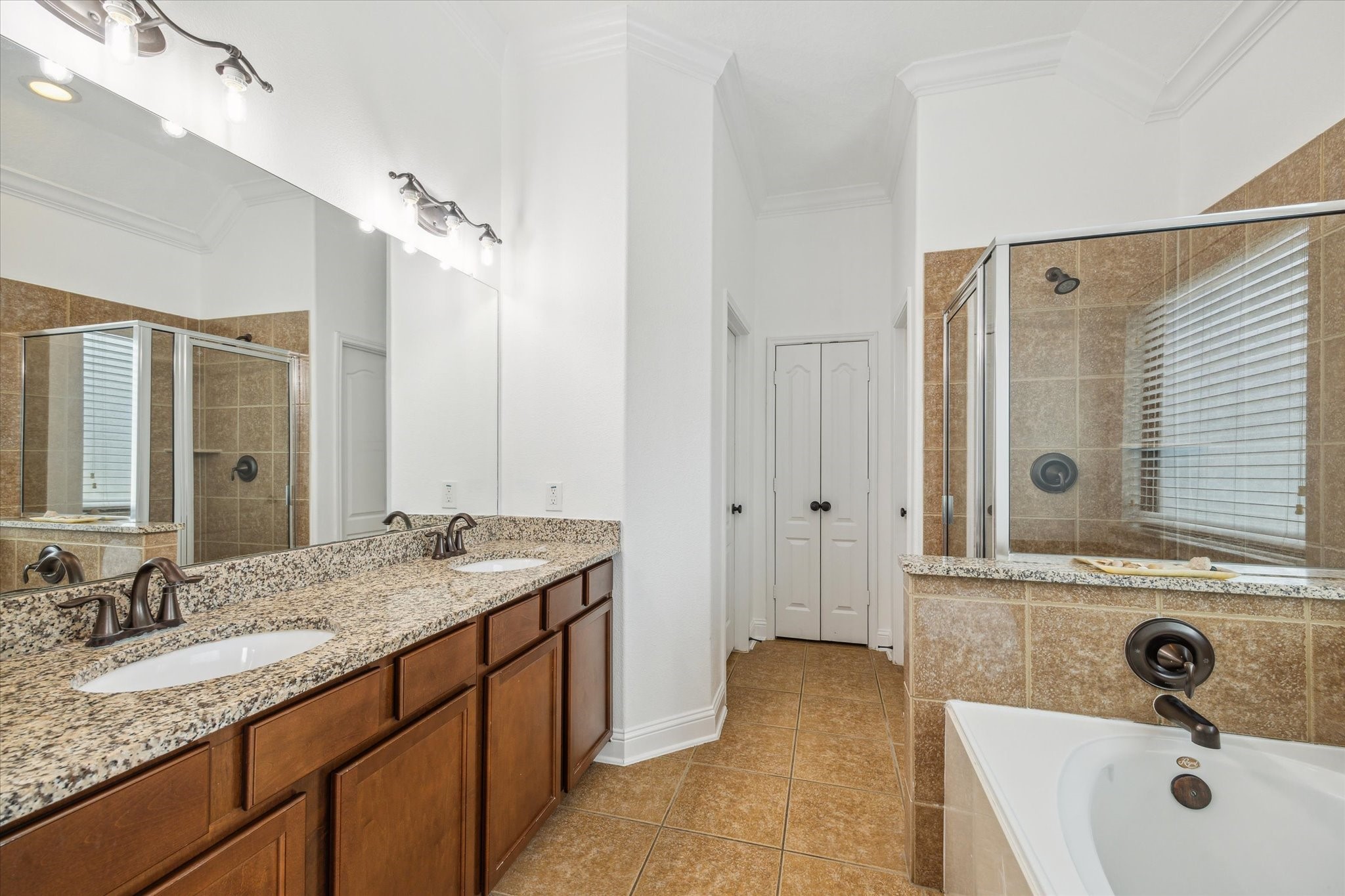 31 Butternut Grove Place Tomball, TX 77375 - Photo 10 of 25 a bathroom with a sink and a mirror