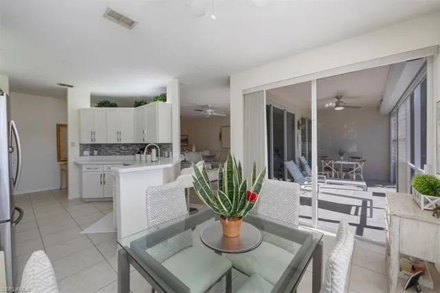 a kitchen with a table and chairs in it