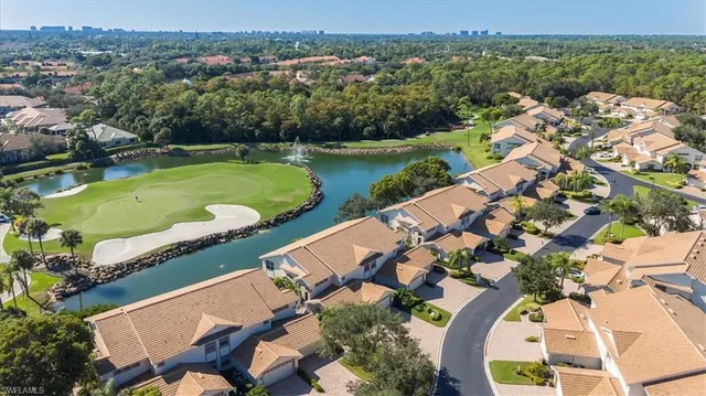 an aerial view of a house with a lake view