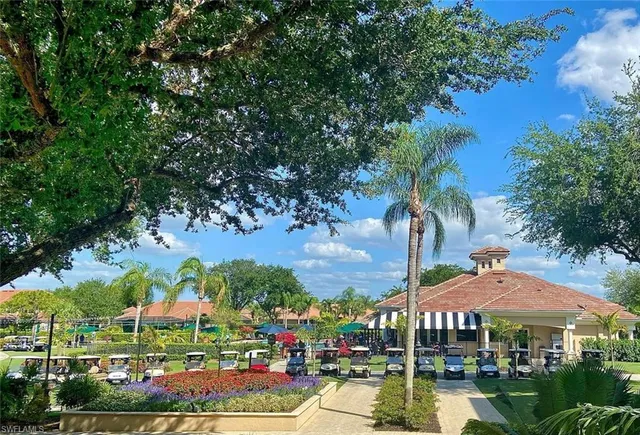 a view of swimming pool with outdoor seating and a garden