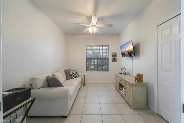 a living room with furniture and a window