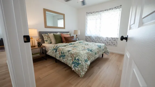 a bedroom with a bed and a window