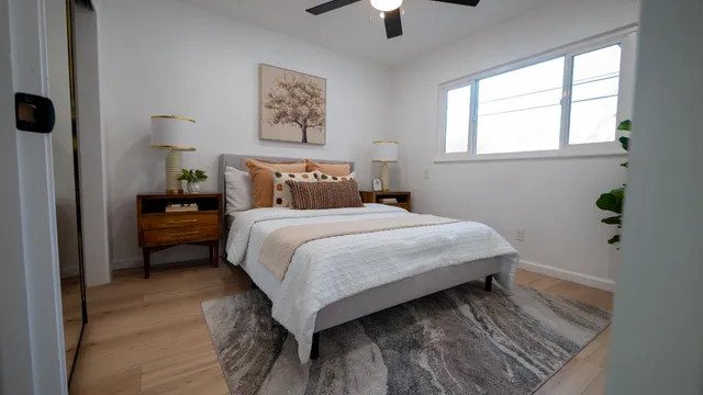 a bedroom with a bed and a window