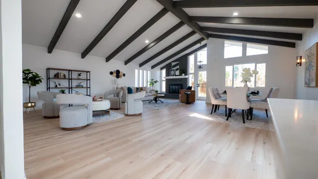 a living room with furniture and wooden floors