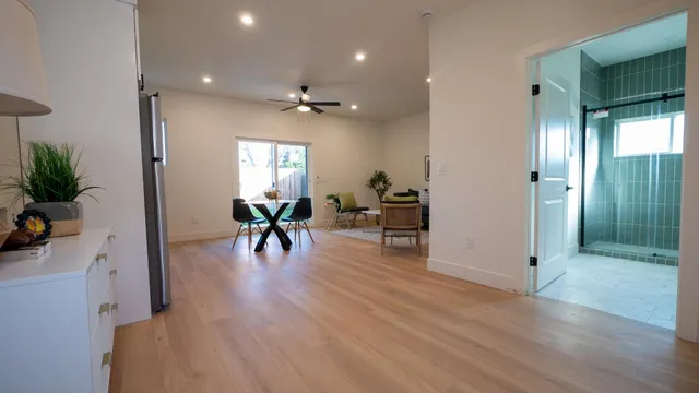 a view of a livingroom with furniture and a workspace
