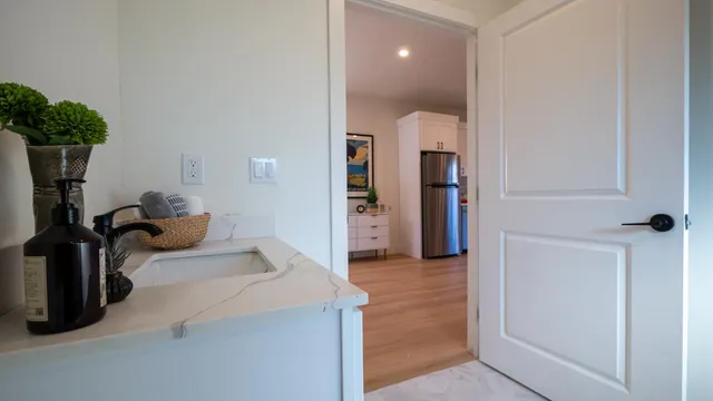 a bedroom with furniture and a potted plant