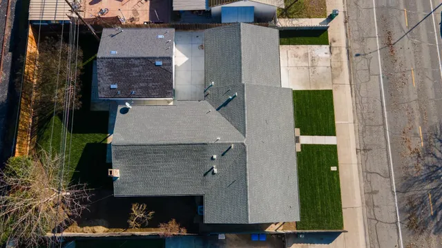 an aerial view of a house with a yard and a garage