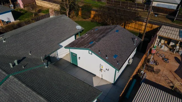 an aerial view of house with yard
