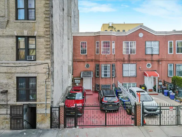 a front view of a building with many windows