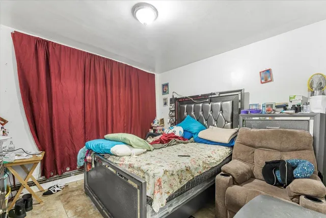 a living room with furniture and a chair