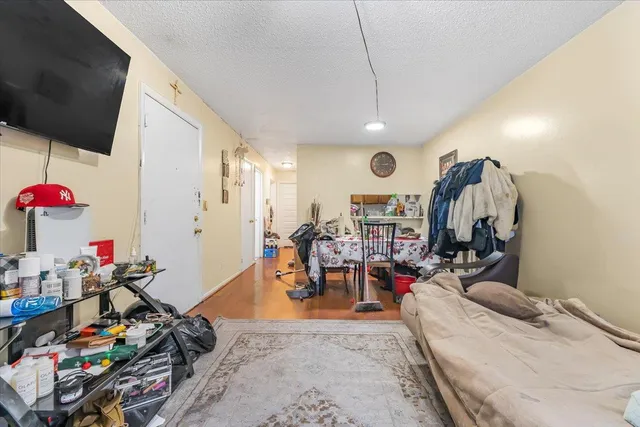 a living room filled with furniture and a flat screen tv