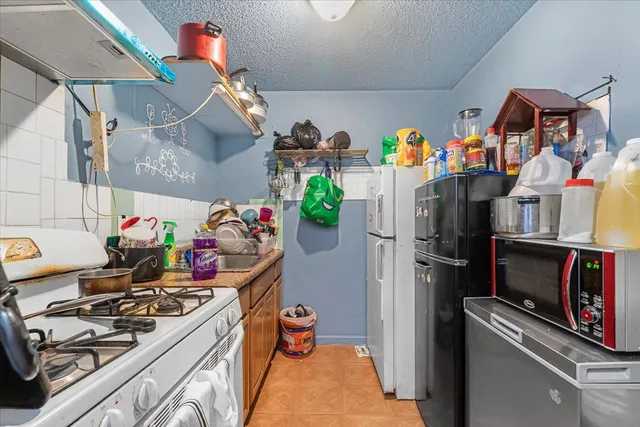 a view of a kitchen with appliances and cabinets