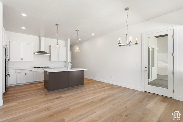 549 North Legend Circle, Unit C/466 Mapleton, UT 84664 - Photo 11 of 39 Kitchen featuring light countertops, a chandelier, light wood-type flooring, white cabinetry, and recessed lighting