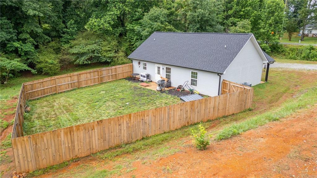118 Wash Rider Road Dahlonega, GA 30533 - Photo 37 of 37 a view of house with backyard and trees