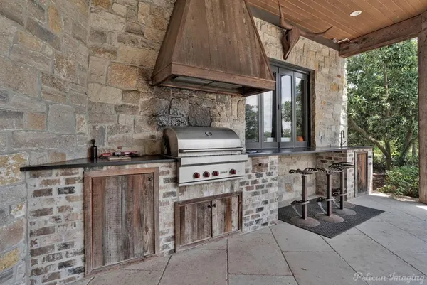 an aerial view of a house with ocean view