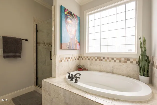 a white bath tub sitting next to a window