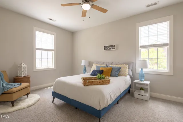 a bedroom with a bed and a couch