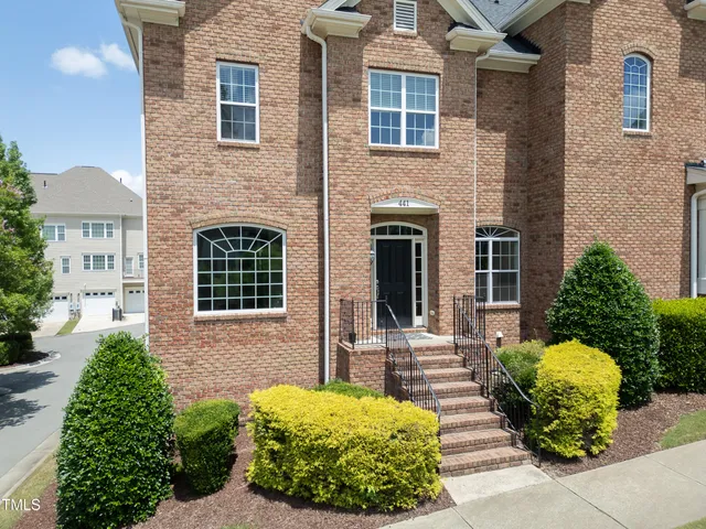 a view of house with yard