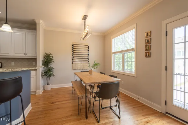 a workspace with furniture window and wooden floor