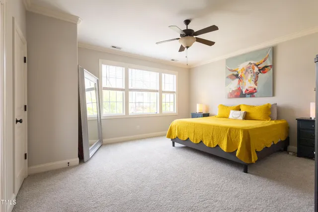 a bed sitting in a room next to a window