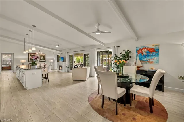 a view of a dining room with furniture wooden floor and a chandelier