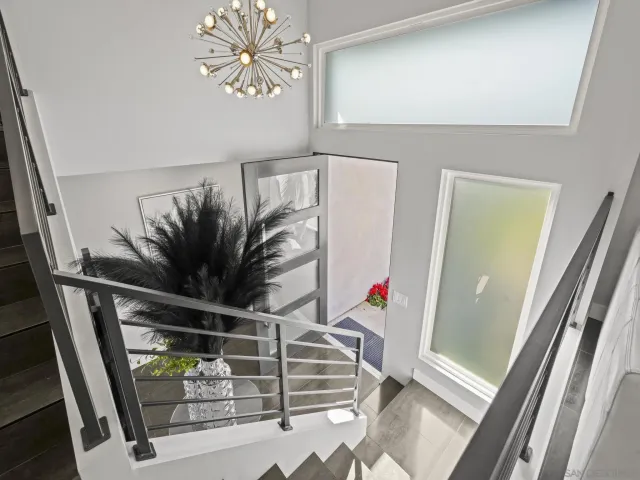 a kitchen with kitchen island a white counter top space cabinets and stainless steel appliances