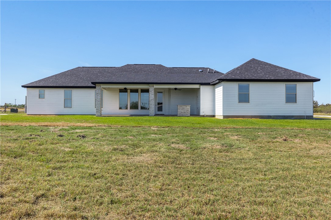 6524 Agave Court Bryan, TX 77808 - Photo 6 of 43 a white house that has a big yard and more windows