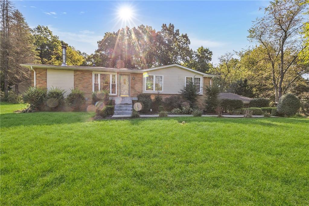 183 Murdocksville Road Clinton, PA 15026 - Photo 22 of 23 a front view of house with yard and green space