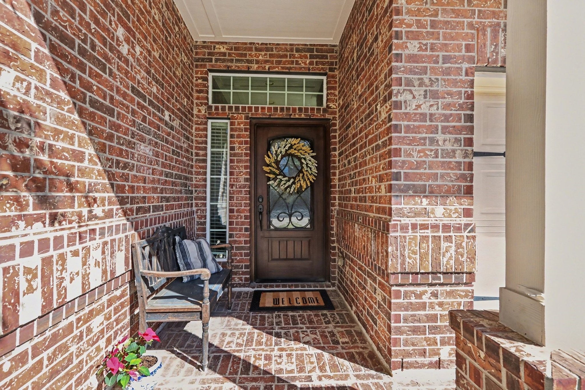 27006 Cliff Pointe Lane Katy, TX 77494 - Photo 3 of 34 A cozy, covered front porch sets the tone—perfect for morning coffee, evening conversations, and welcoming guests in style.