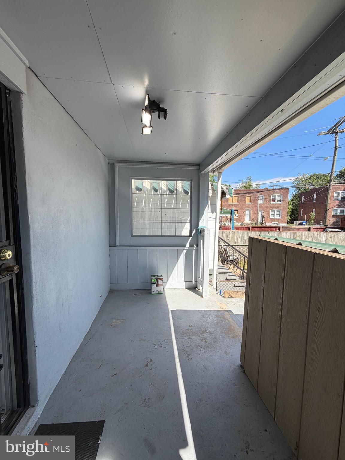 1353 Cambria Street Baltimore, MD 21225 - Photo 20 of 23 a view of a hallway with a large window