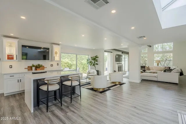 a living room with furniture and a rug