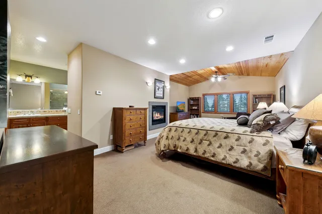 a bedroom with bed and window