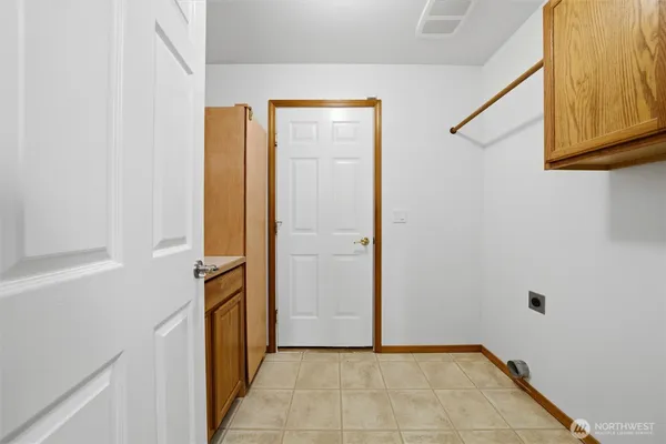 a view of a hallway with closet and bathroom