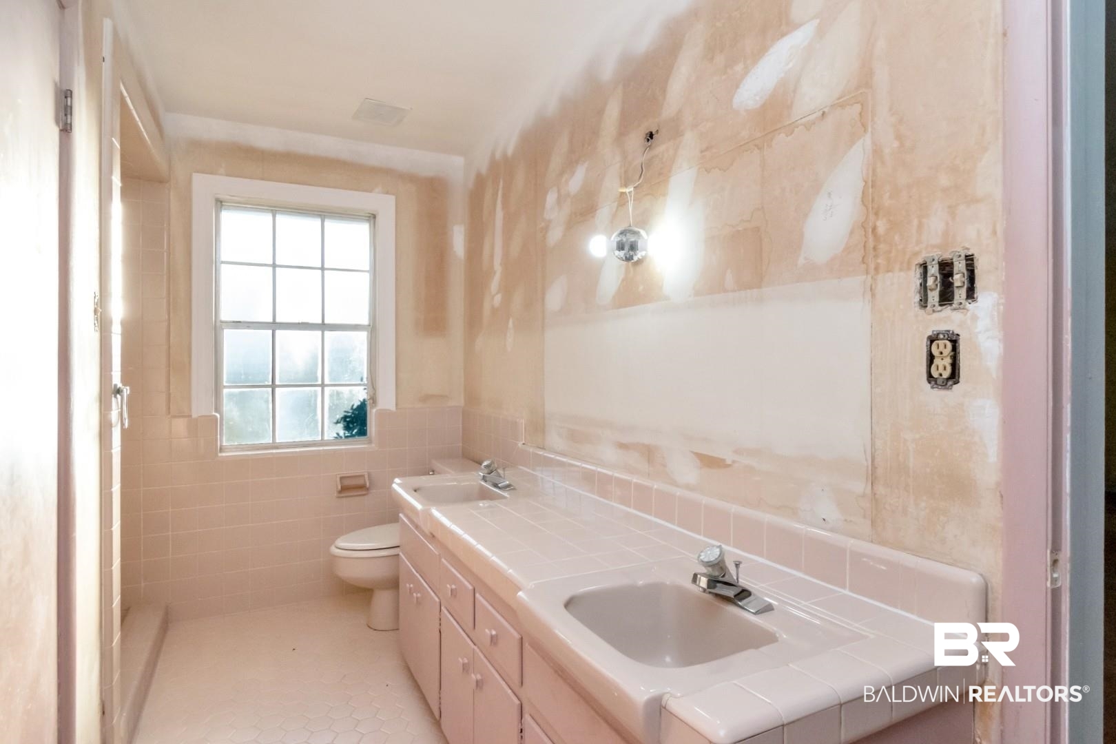 241 Suzanne Circle Mobile, AL 36608 - Photo 18 of 41 Bathroom with double vanity, tile walls, and tile patterned flooring