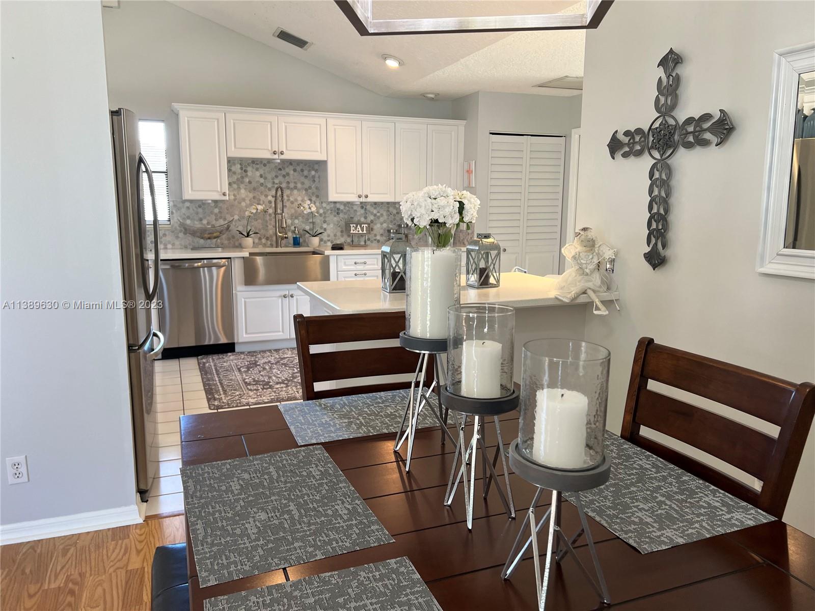 6159 Dimond Street Jupiter, FL 33458 - Photo 20 of 26 a living room with furniture and a rug