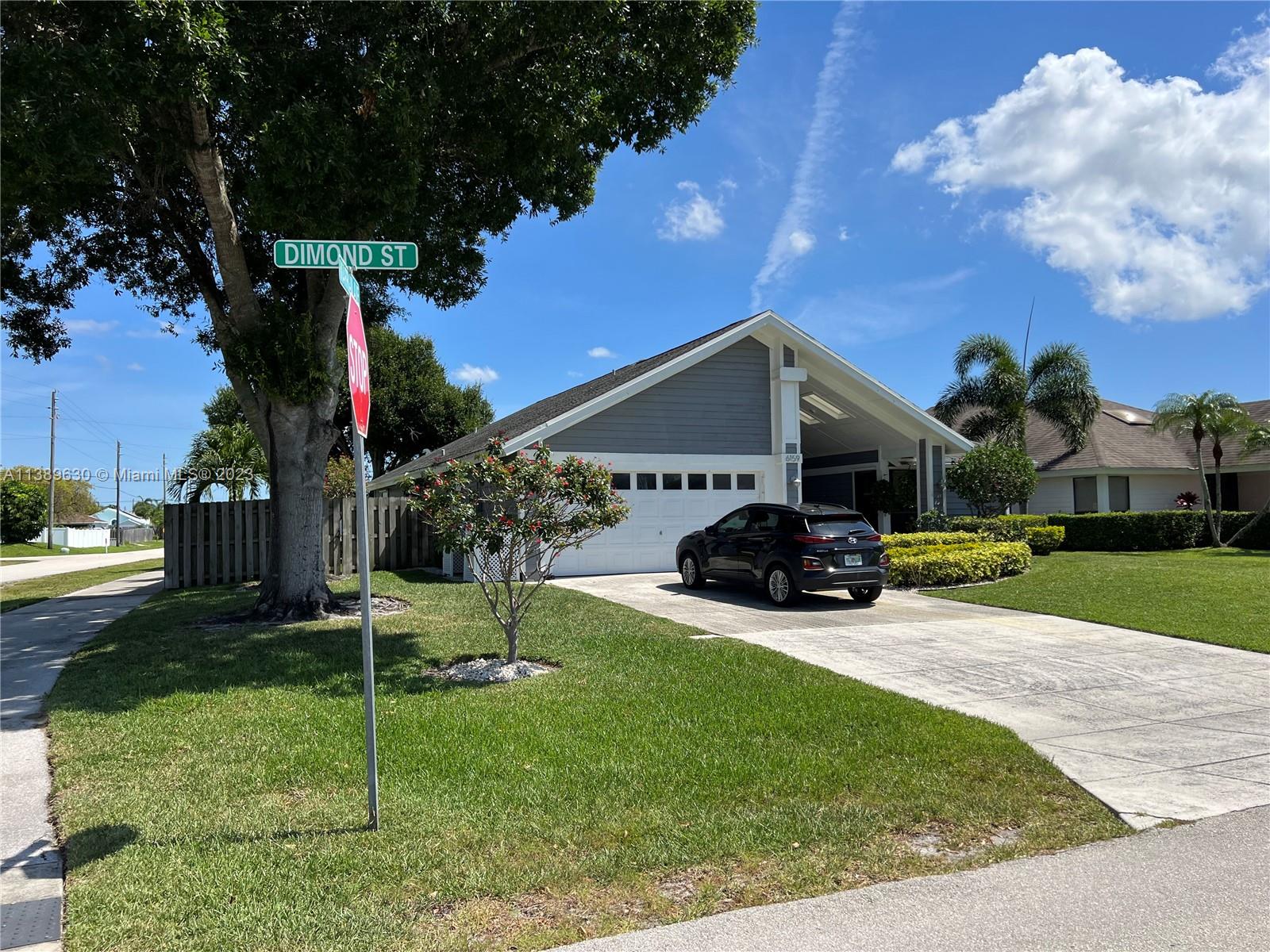 6159 Dimond Street Jupiter, FL 33458 - Photo 26 of 26 a view of house and outdoor space