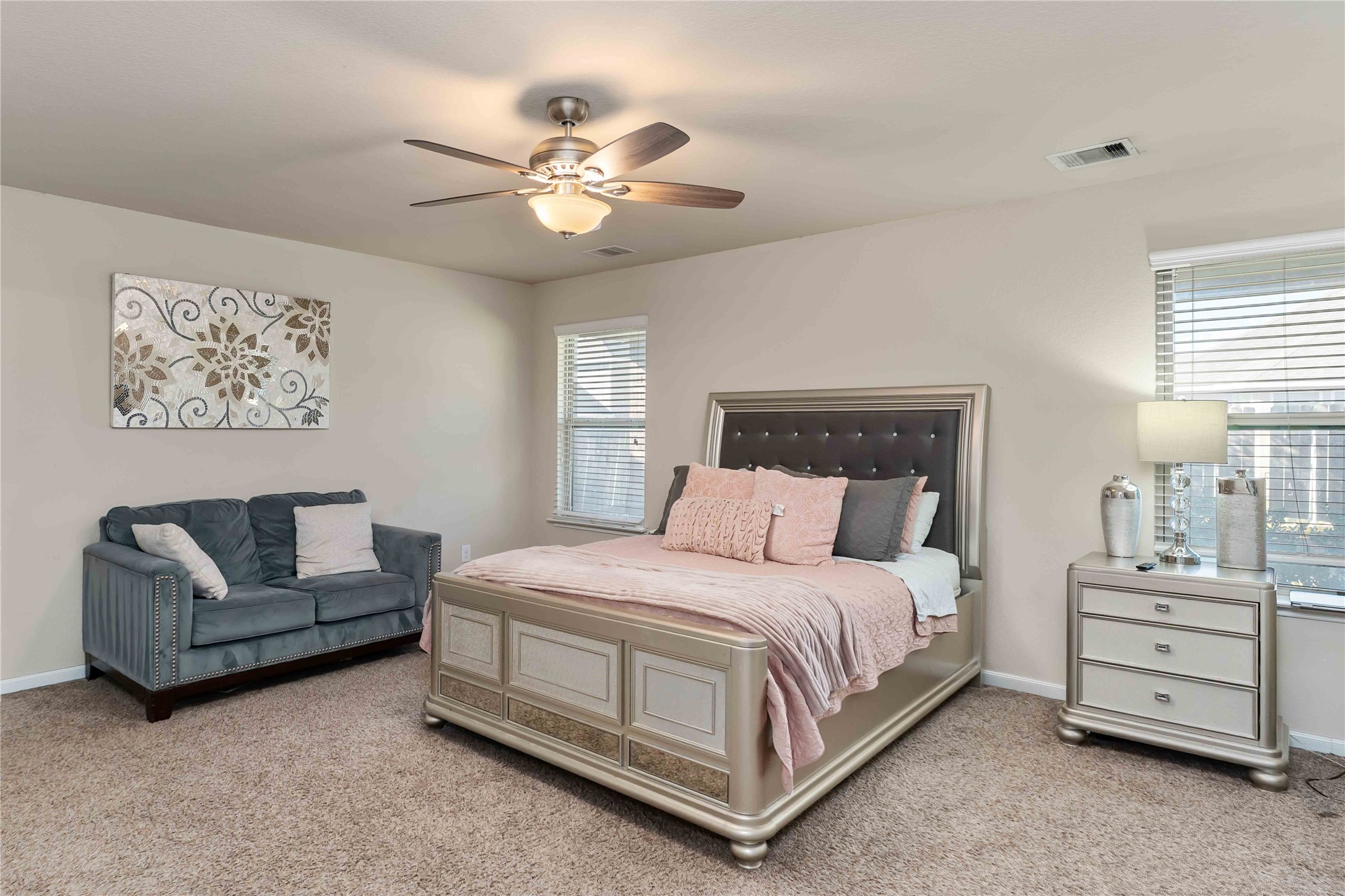 9902 Bezeled Cir Lane Rosharon, TX 77583 - Photo 19 of 26 a bedroom with a bed a couch and cabinet