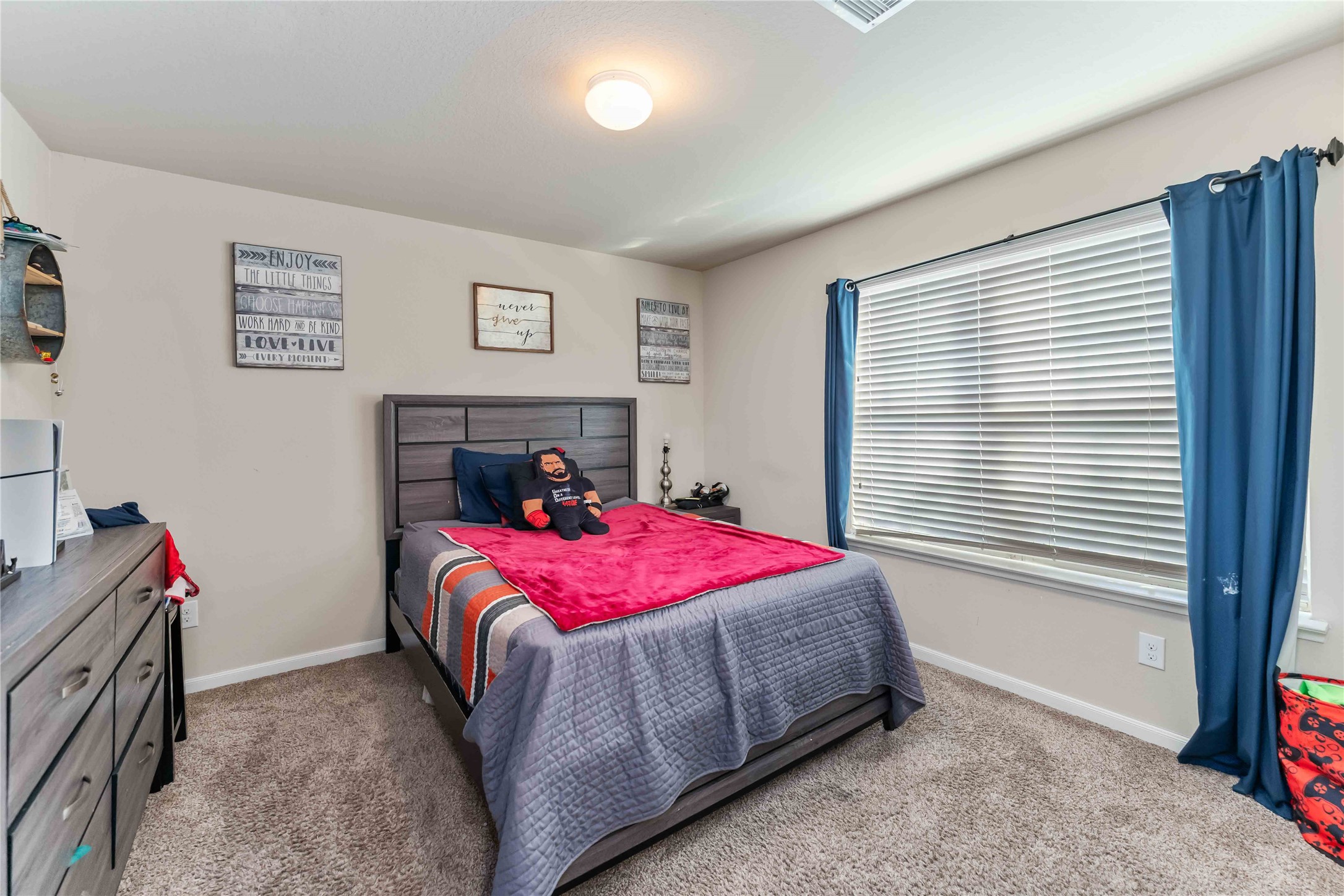 9902 Bezeled Cir Lane Rosharon, TX 77583 - Photo 23 of 26 a bedroom with a bed and a window