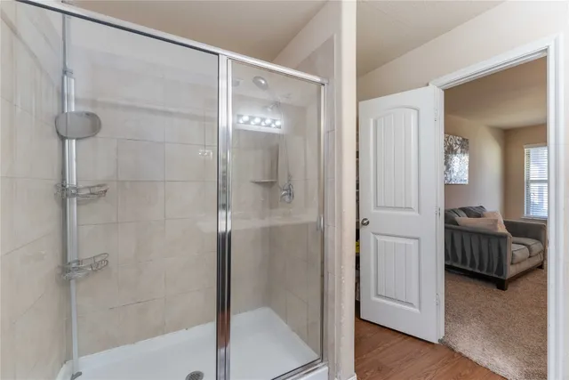 a bathroom with a toilet and a mirror