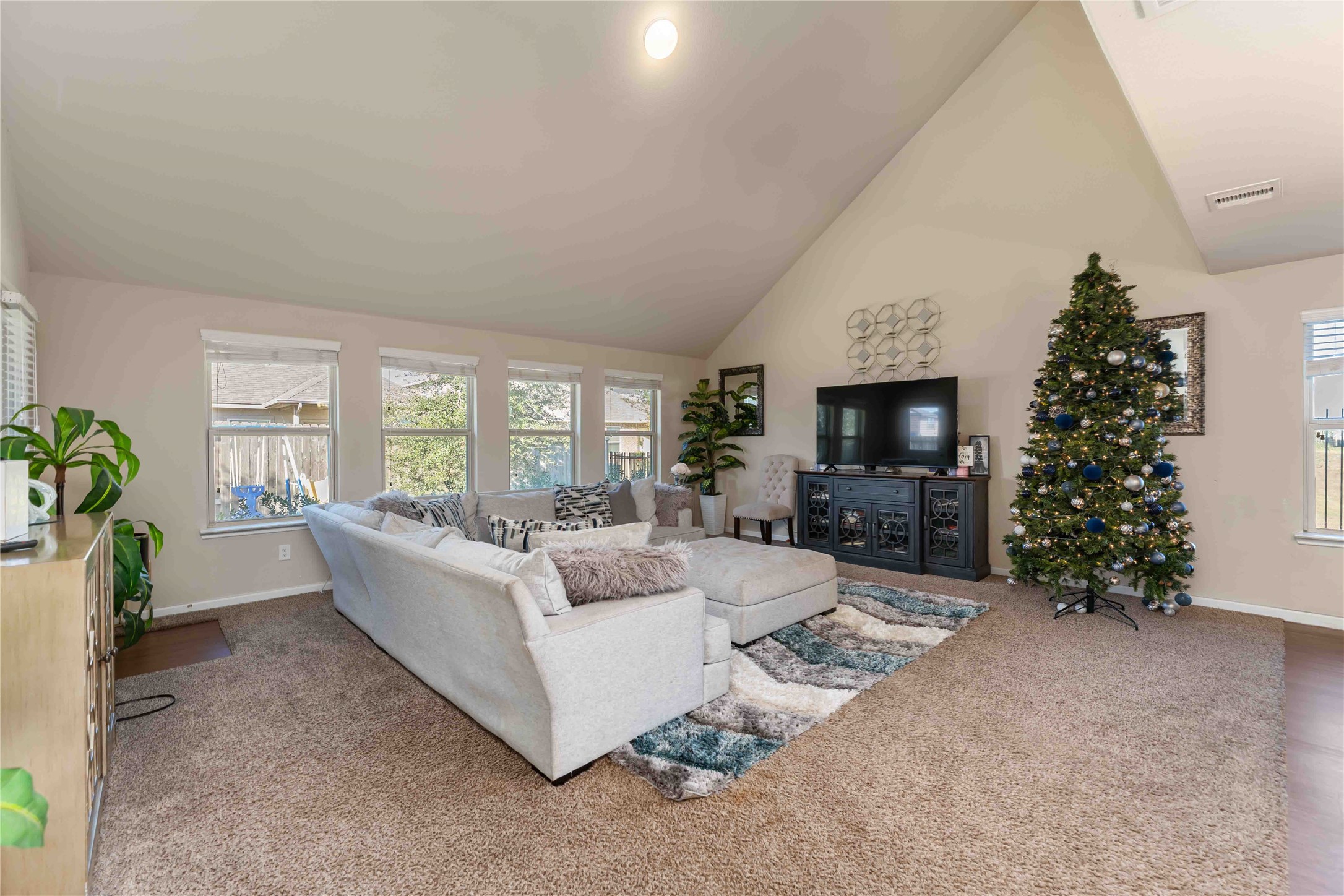 9902 Bezeled Cir Lane Rosharon, TX 77583 - Photo 8 of 29 a living room with furniture a large window and a fireplace
