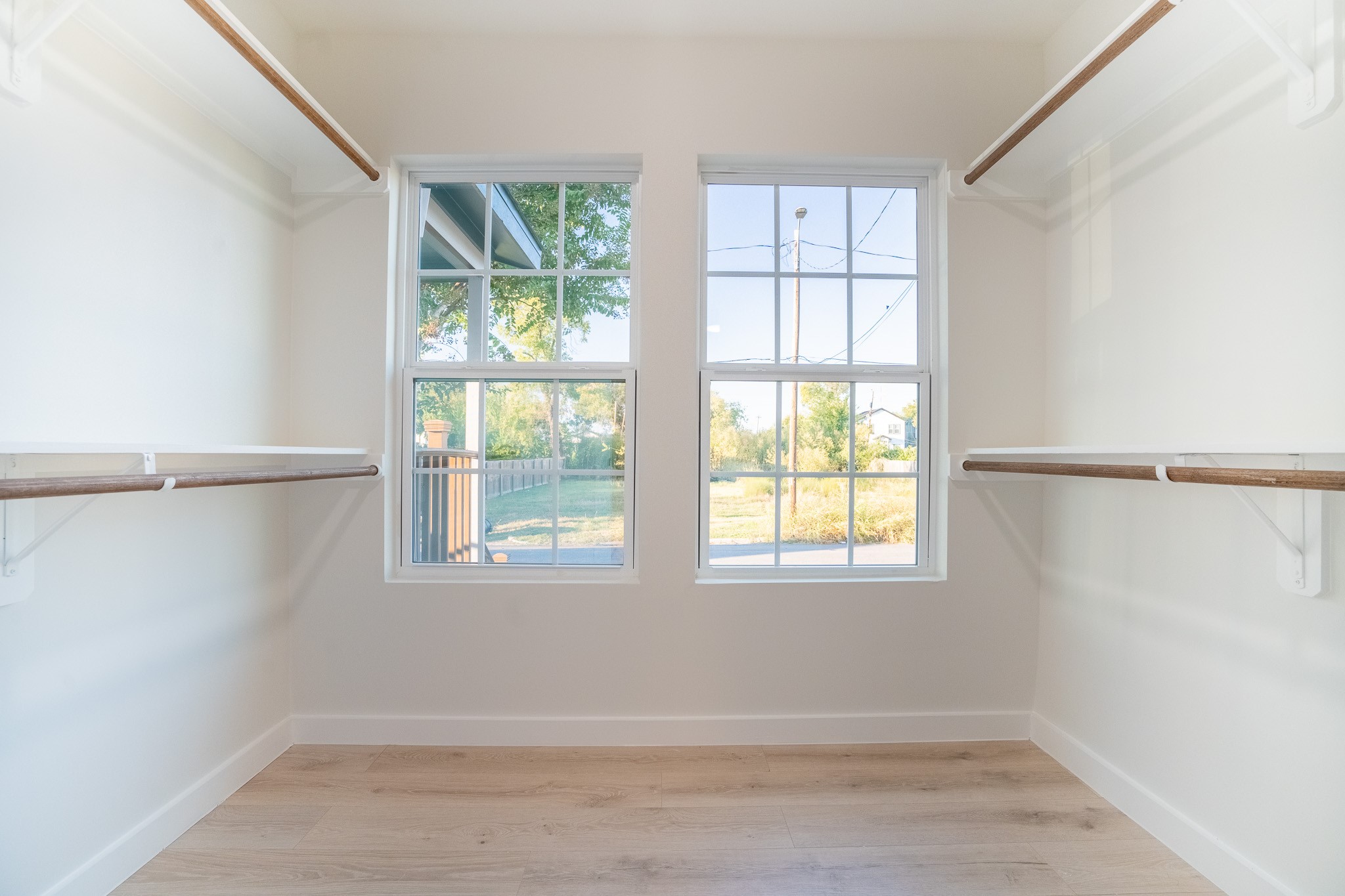 1310 East 34th Street Houston, TX 77022 - Photo 16 of 19 an empty room with wooden floor and windows