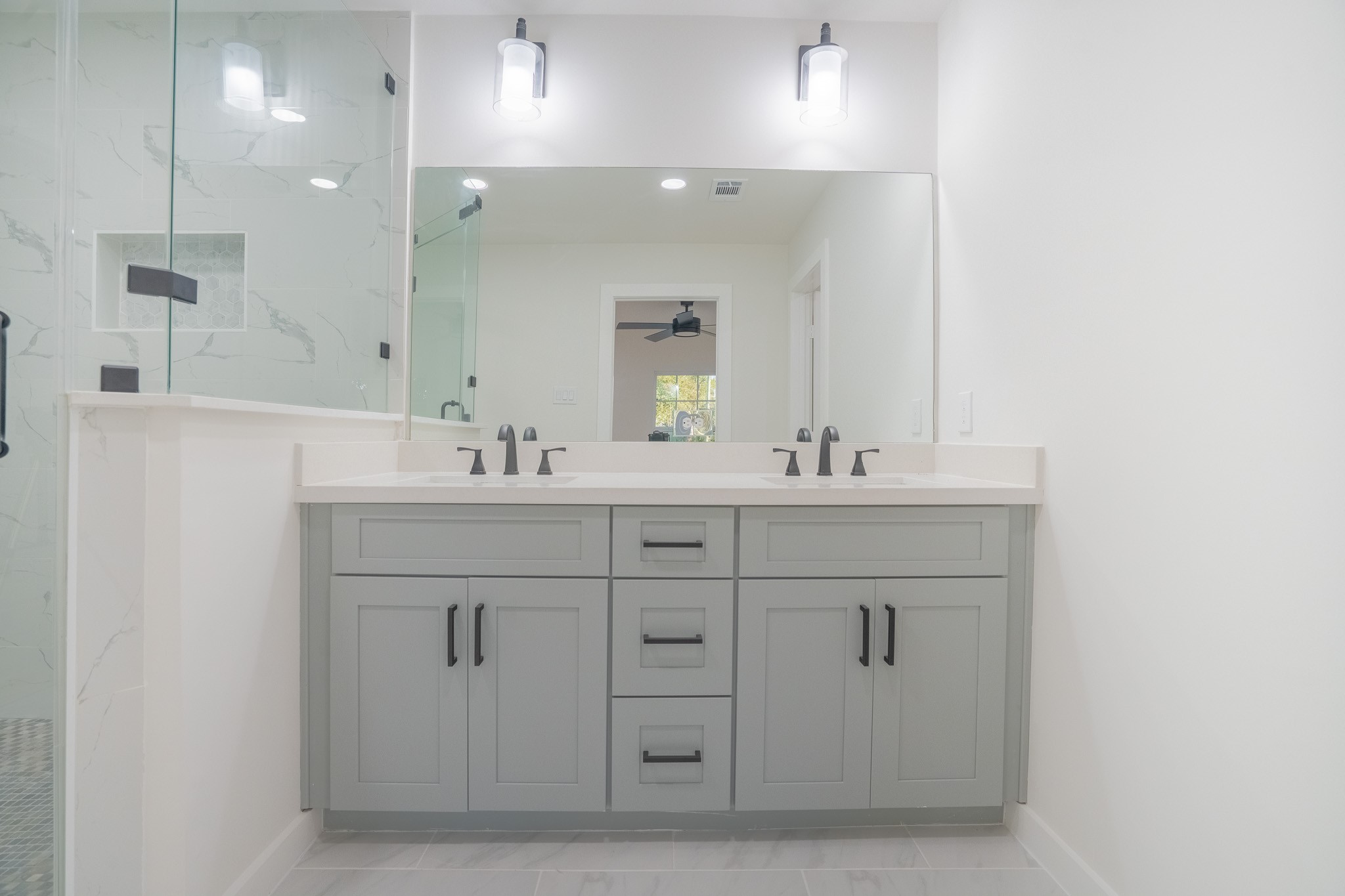 1310 East 34th Street Houston, TX 77022 - Photo 18 of 19 a bathroom with a sink vanity and mirror