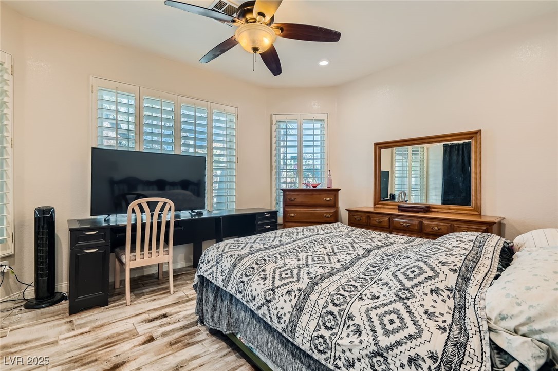 20 High Sierra Henderson, NV 89074 - Photo 26 of 53 Bedroom featuring recessed lighting, light wood-style flooring, and a ceiling fan