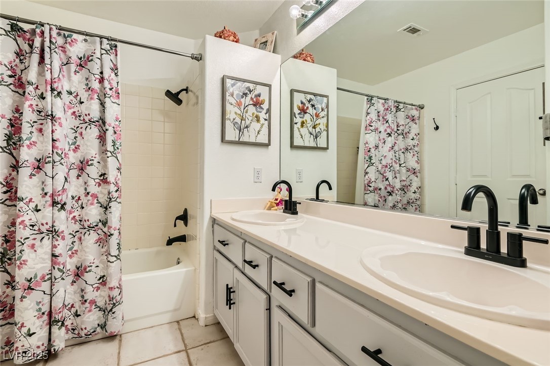 20 High Sierra Henderson, NV 89074 - Photo 38 of 53 Full bathroom with a sink, visible vents, double vanity, and shower / bath combination with curtain