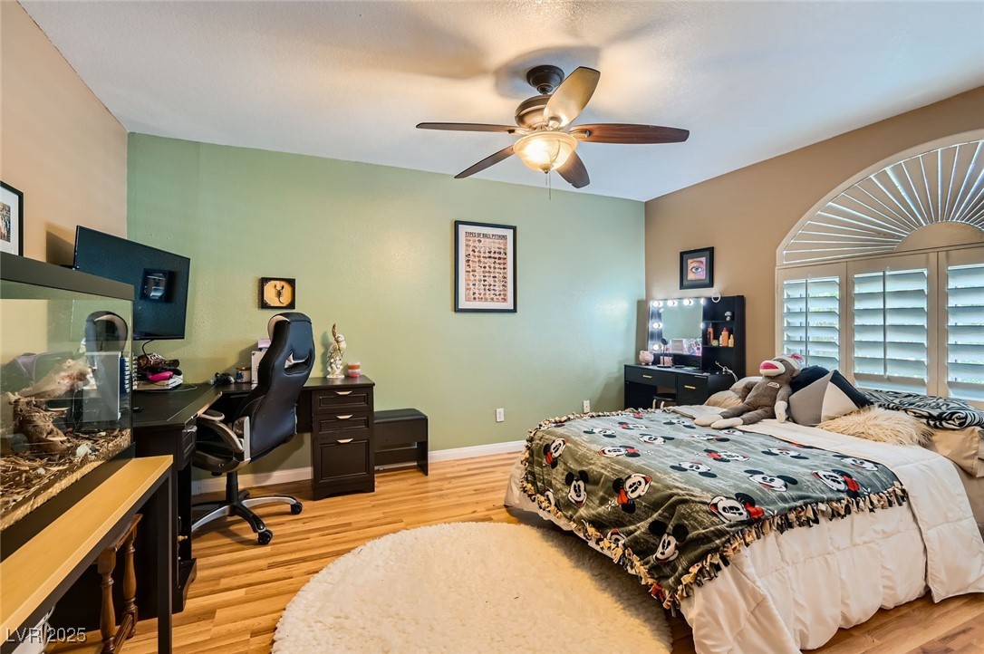 20 High Sierra Henderson, NV 89074 - Photo 39 of 53 Bedroom featuring ceiling fan, baseboards, and light wood-style floors