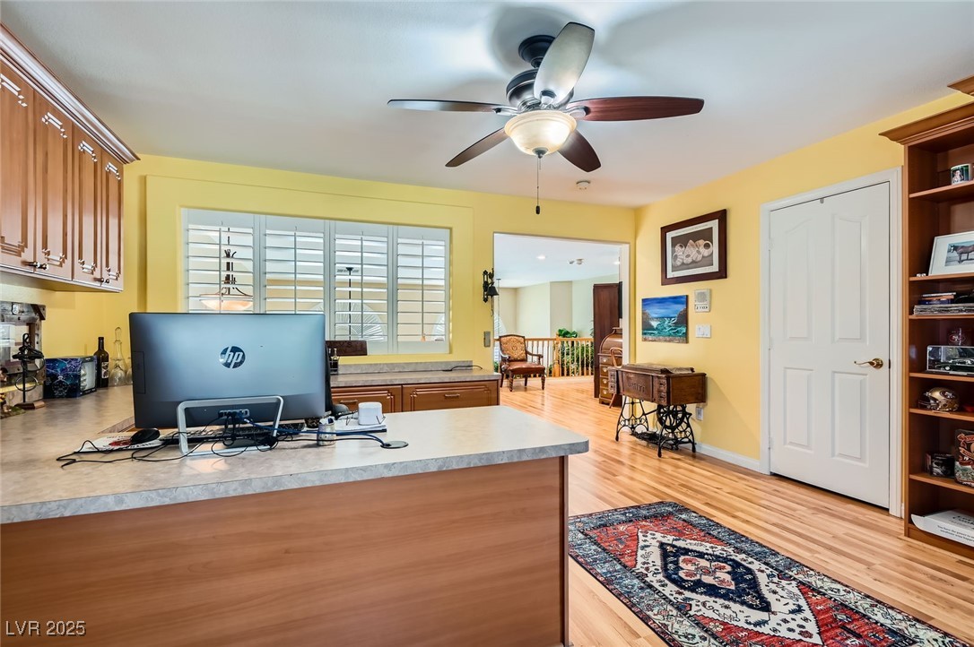 20 High Sierra Henderson, NV 89074 - Photo 43 of 53 Office space featuring baseboards, light wood-style flooring, and a ceiling fan